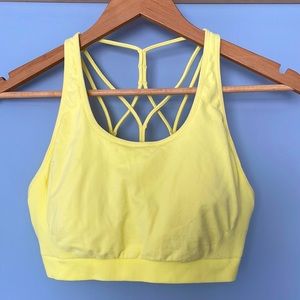 Canary yellow strappy-back sports bra. Fits Large-XL